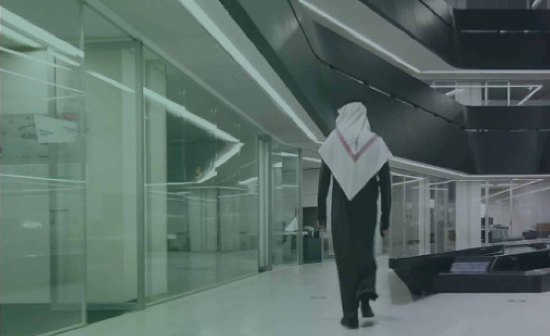 Executive walking through a modern corporate interior